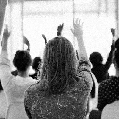 People raising their hands to ask questions