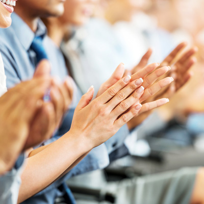 People raising their hands to ask questions